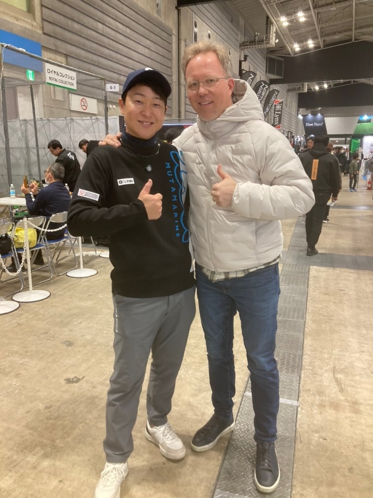 Tom Kotter and a Japanese golf industry contact giving thumbs-up at a Tokyo golf expo